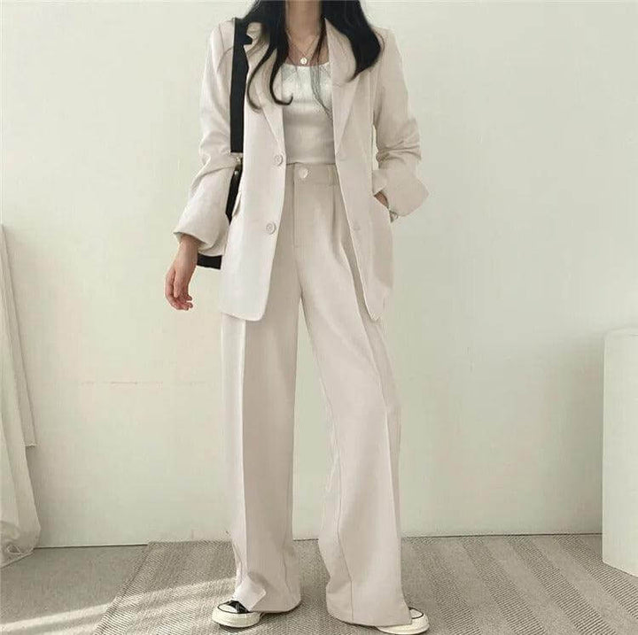 Formal women's professional suit: tailored blazer and straight-leg pants for elegance.
