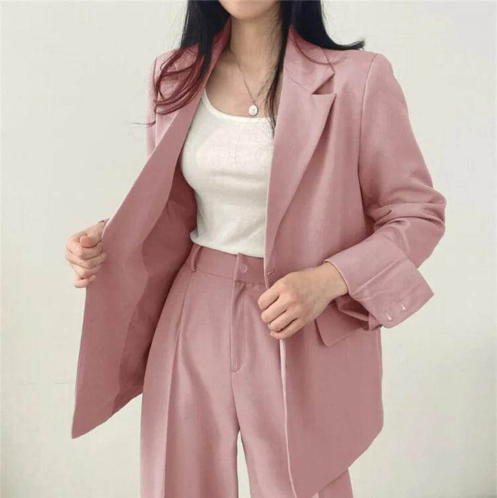Elegant women's suit with tailored blazer & straight-leg pants, perfect for workwear.