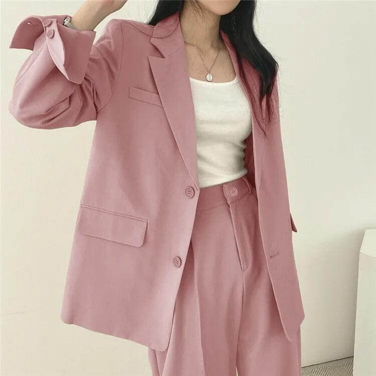 Chic women's two-piece set: professional tailored blazer and straight-leg pants outfit.