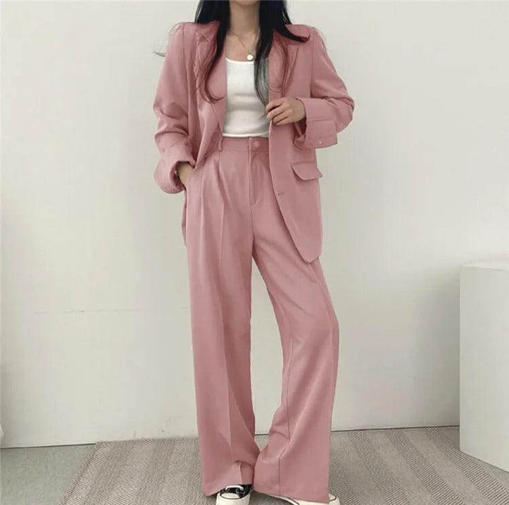 Sophisticated women's blazer and straight-leg pants suit, ideal for formal wear.