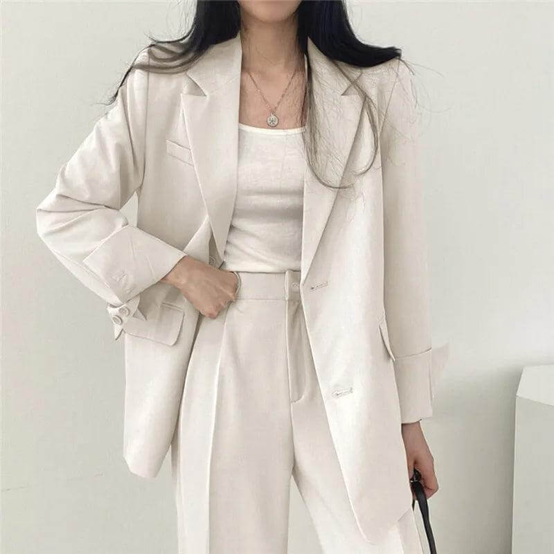 Professional women's set: a tailored blazer paired with elegant straight-leg pants.