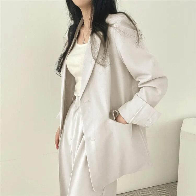 Women's tailored blazer, part of a sophisticated straight-leg pants suit for work.