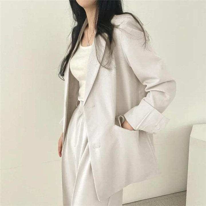 Women's tailored blazer, part of a sophisticated straight-leg pants suit for work.