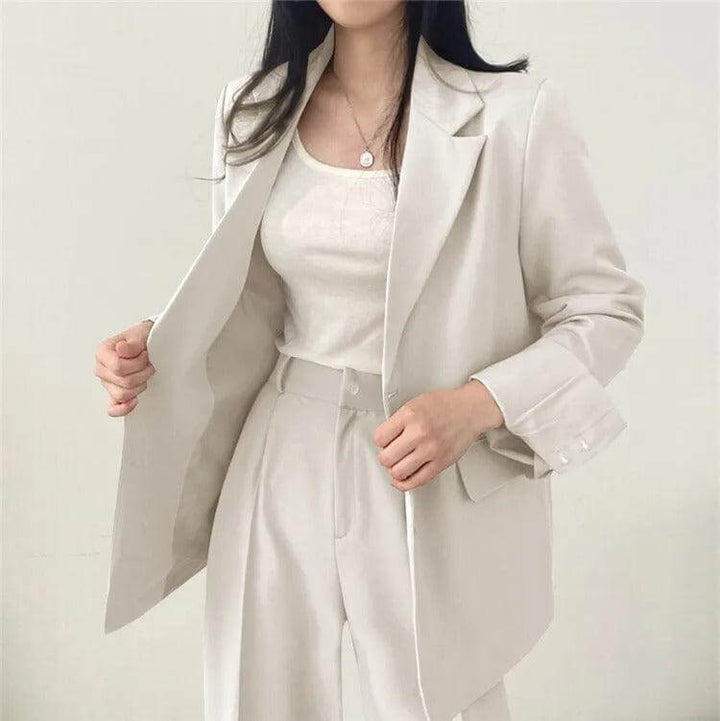 Stylish women's straight-leg pants and matching tailored blazer, perfect for business.