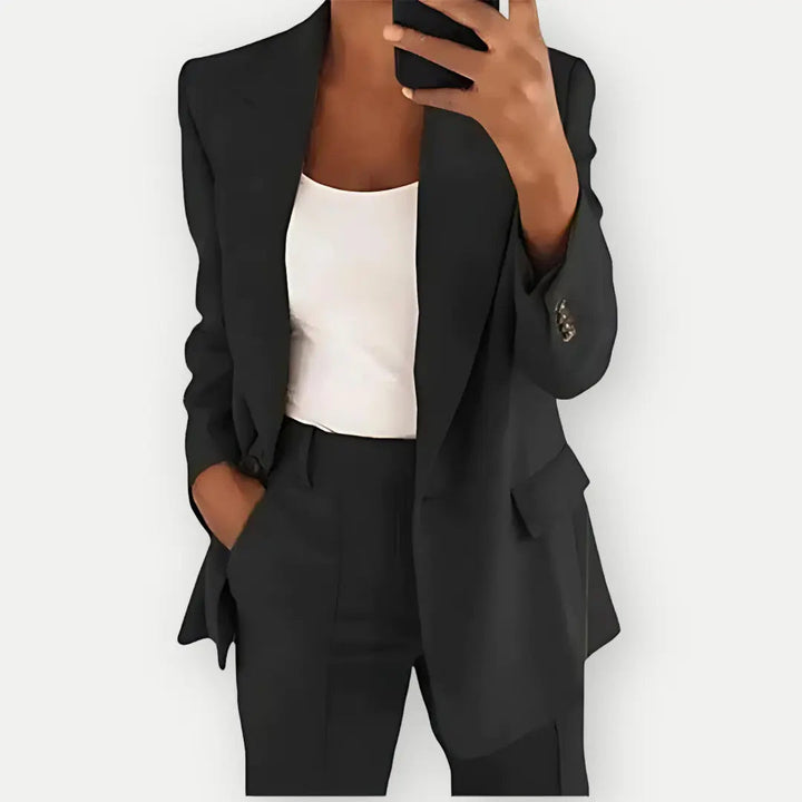 Elegant women's two-piece tailored blazer and trouser set, versatile for formal or business fashion.