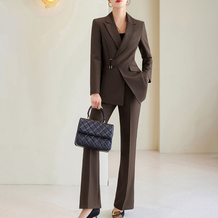 Blue women's tailored blazer and black trousers two-piece suit, perfect for business and formal professional wear.