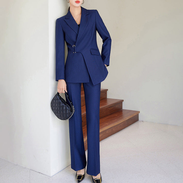 Elegant brown women's tailored blazer and trousers set, sophisticated two-piece for formal wear or office attire.