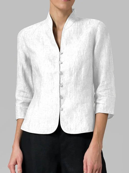 Back view of women's tailored linen blazer. Sleek design and breathable fabric for comfortable, elegant summer wear.