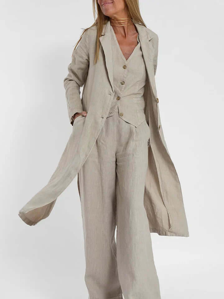 Woman in olive green tailored linen two-piece vest and pants set, showcasing elegant fit.