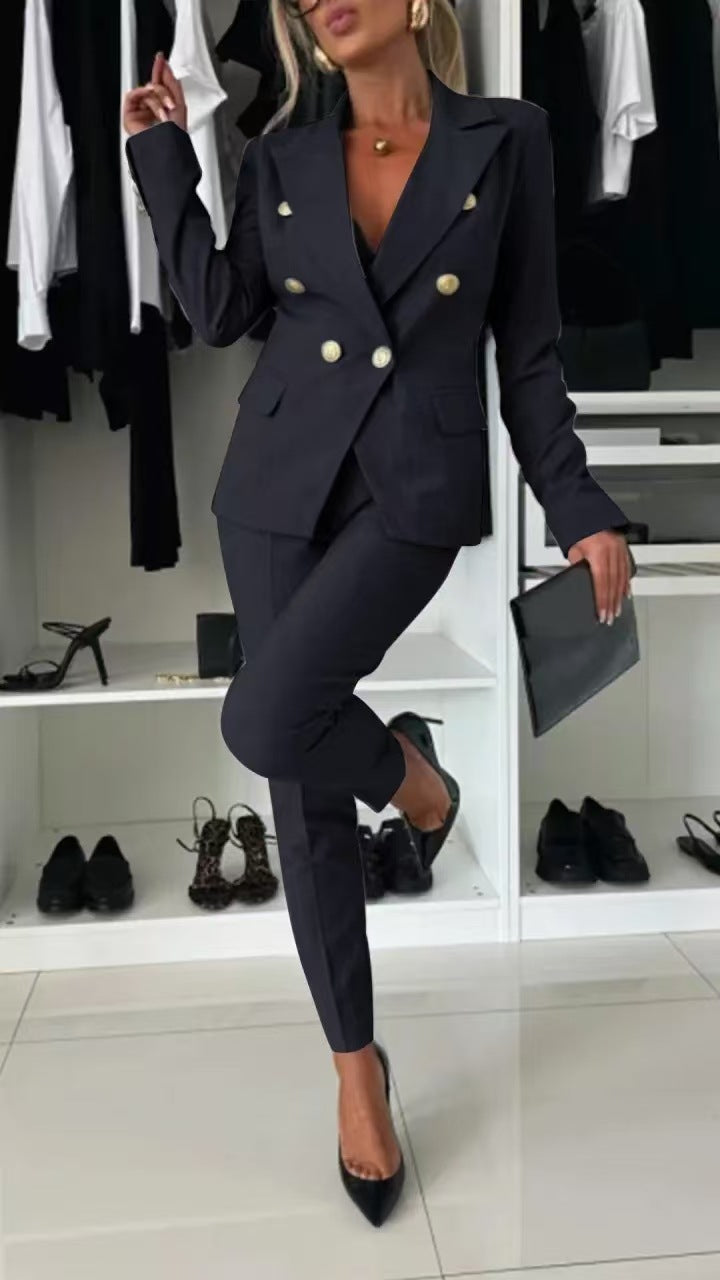 Women's tailored two-piece blazer and trousers set in a professional color, perfect for office wear & business attire.