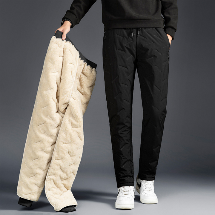 Women's thermal waterproof fleece-lined trousers for cold weather outdoor activities and hiking.