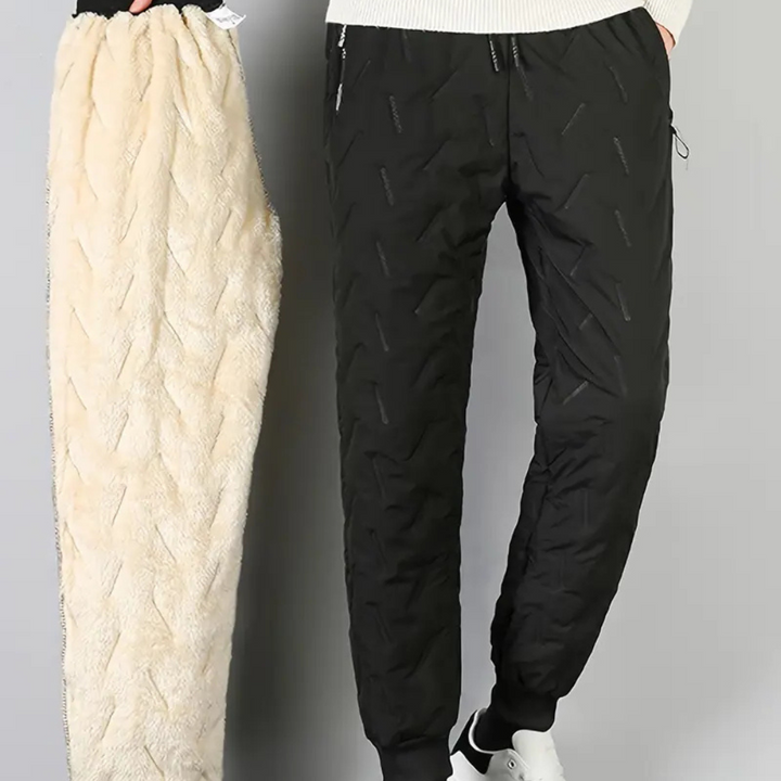 Women's athletic thermal waterproof pants, fleece-lined for cold weather sports, running, and outdoor training.