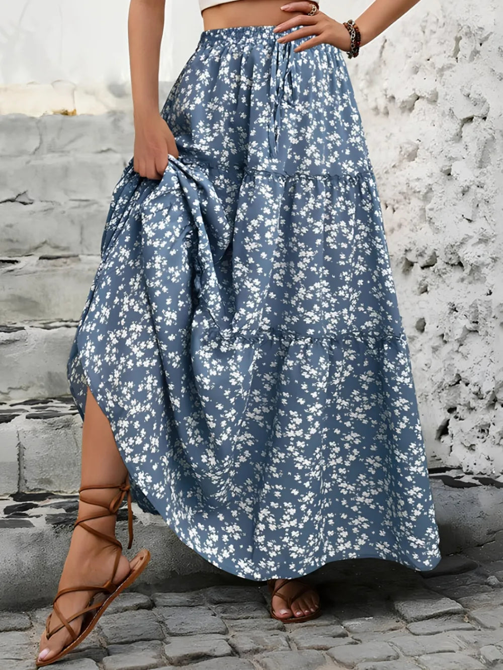 Flowy bohemian tiered floral maxi skirt for women, ideal summer vacation wear.