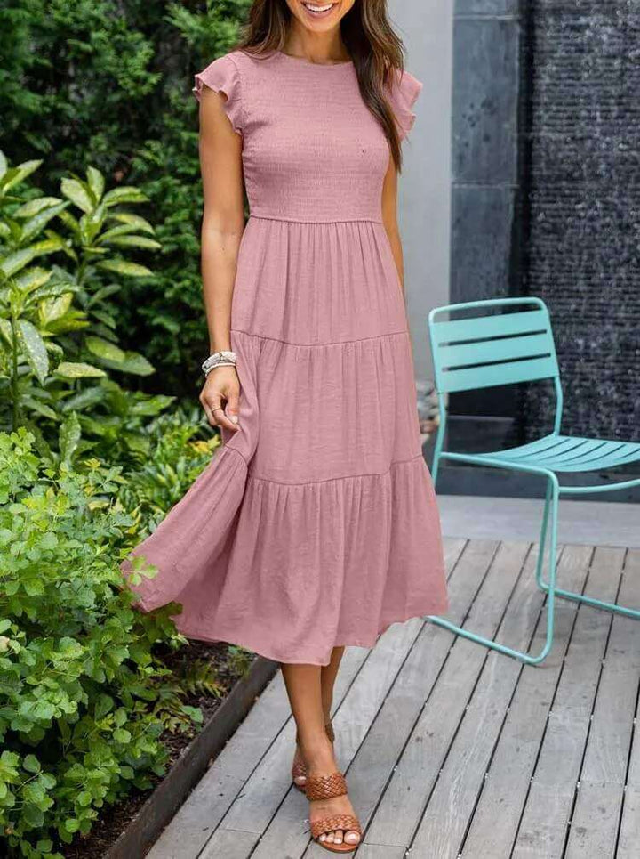 Ladies' tiered A-line midi dress with smocking detail & flutter sleeves, a versatile summer staple.