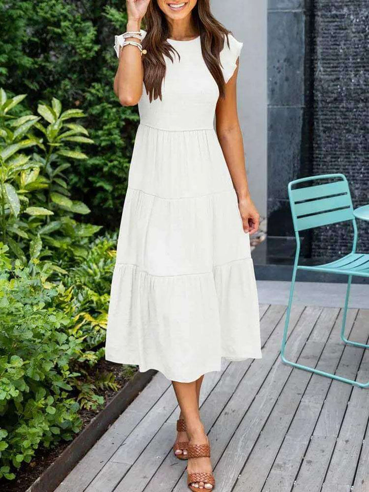 Comfortable women's rayon blend tiered midi dress, versatile flutter sleeves, and a flattering fit.