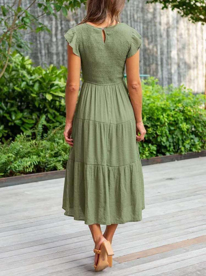 Women's versatile tiered midi dress, A-line cut, delicate flutter sleeves, easy to dress up or down.