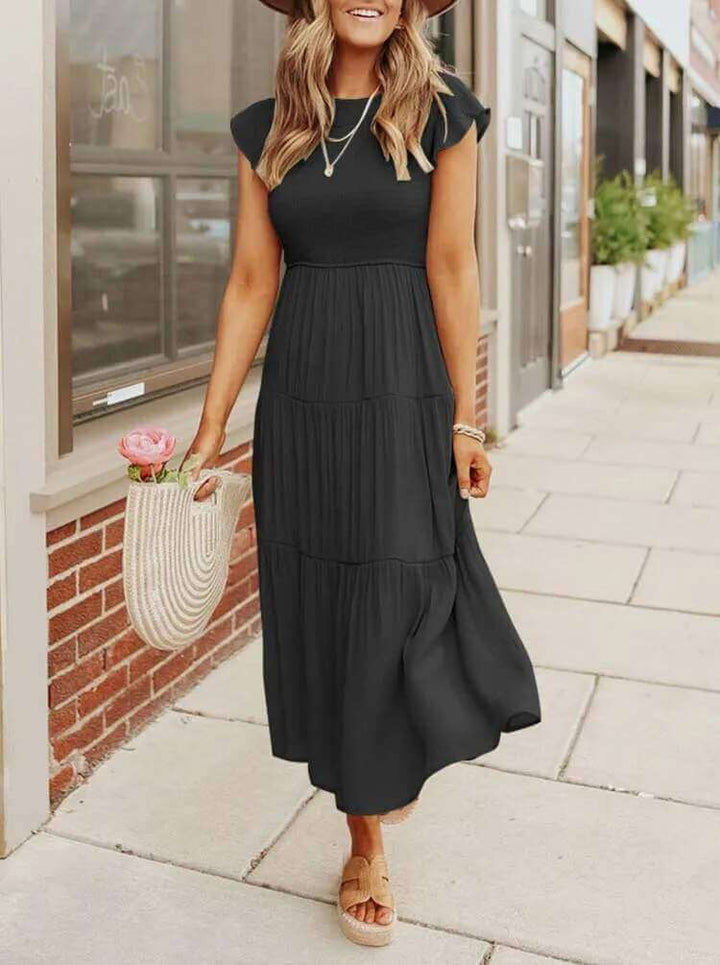 Summer-ready tiered midi dress for women, flowy rayon blend fabric, comfortable and chic.