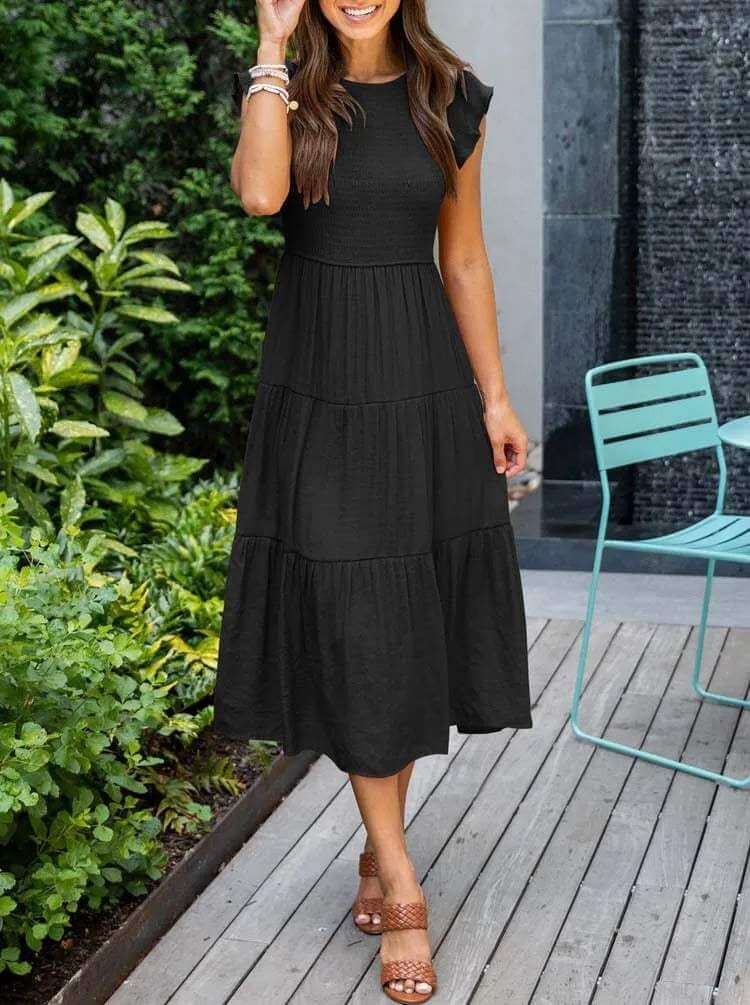 Versatile women's smocked midi dress with tiered skirt & flutter sleeves, ideal for day or evening.