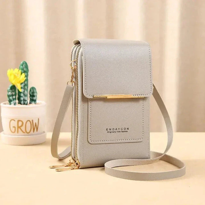 Modern ladies touch screen shoulder bag for smartphones. Chic phone purse & travel organizer.