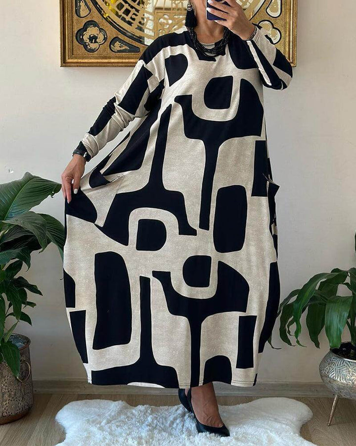 Stylish women's long sleeve printed dress, offering a flattering fit for daily wear and special occasions.