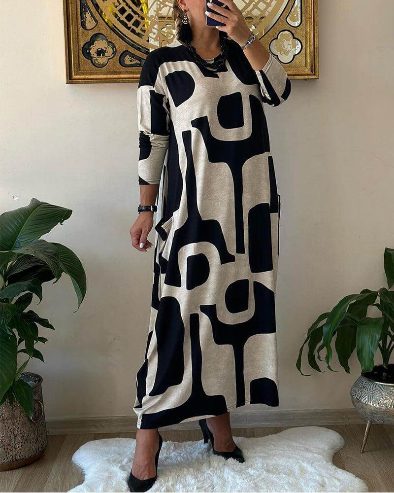 Fashionable women's printed long sleeve dress, designed for comfort and modern style during fall/spring.