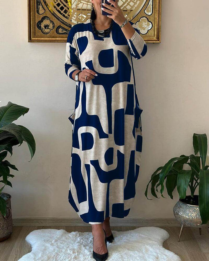 Women's flowy long sleeve dress with an eye-catching print, perfect for a stylish spring or fall ensemble.