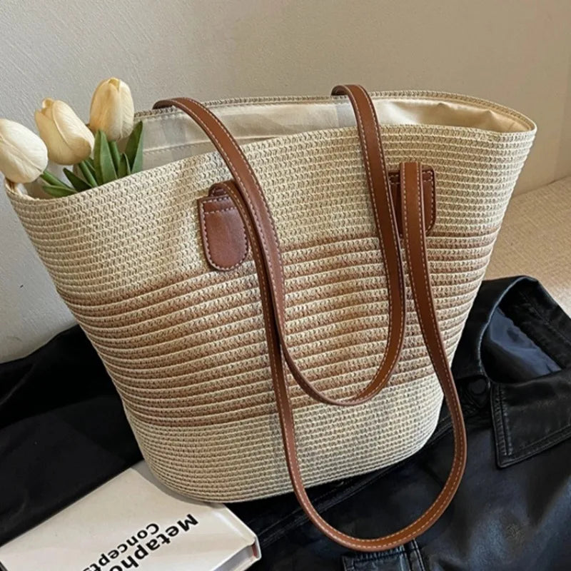 Women's two-tone woven beach tote bag with comfortable shoulder straps, perfect for summer outings and vacation.