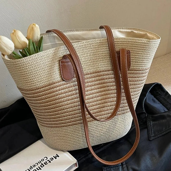 Women's two-tone woven beach tote bag with comfortable shoulder straps, perfect for summer outings and vacation.