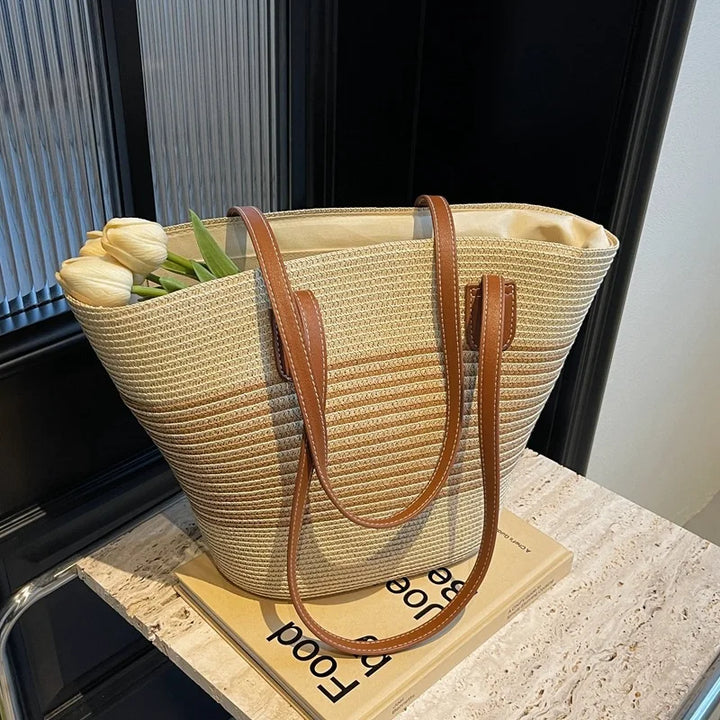 Chic two-tone woven women's tote bag, a spacious shoulder bag for beach essentials and summer accessories.