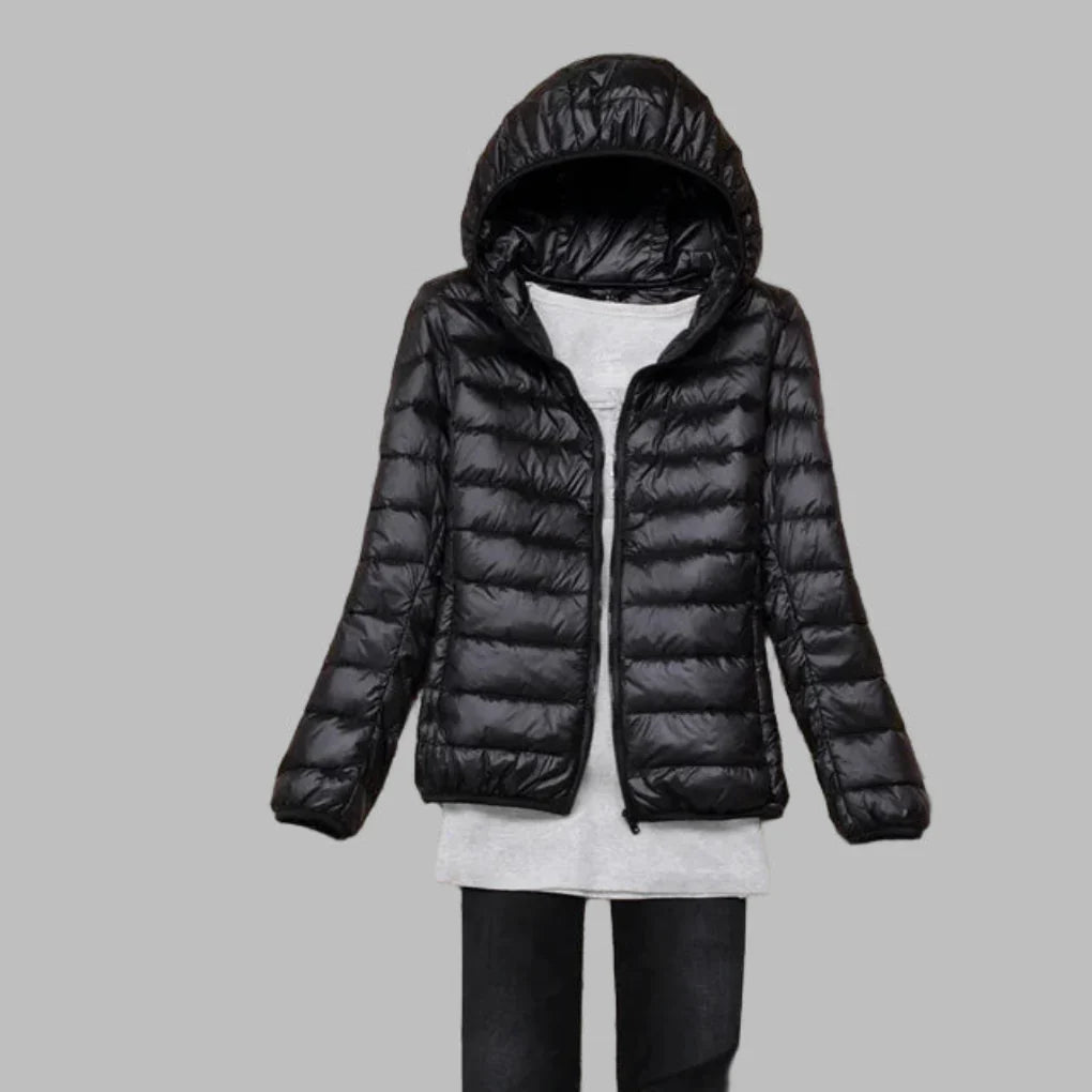 Women's ultra-light packable hooded coat. Warm, compact travel jacket for versatile outdoor wear & comfort.