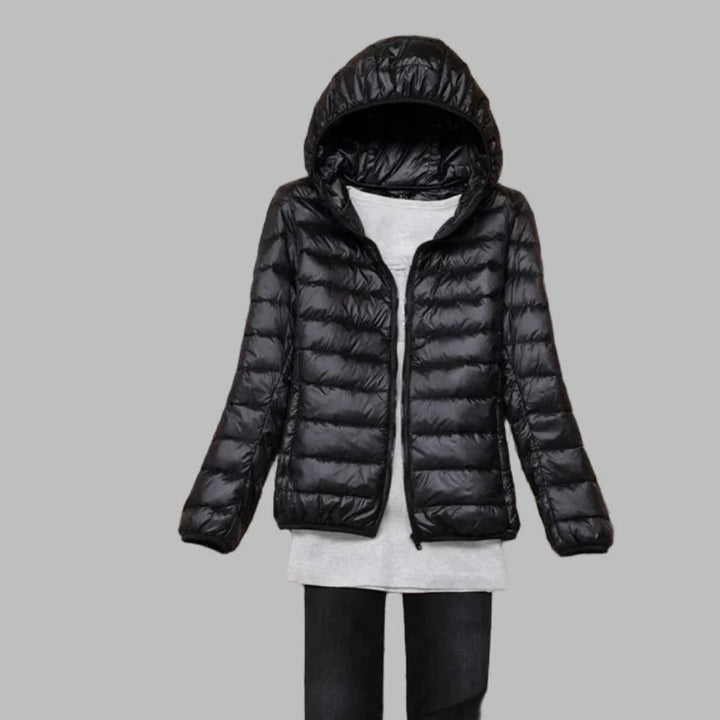 Women's ultra-light packable hooded coat. Warm, compact travel jacket for versatile outdoor wear & comfort.