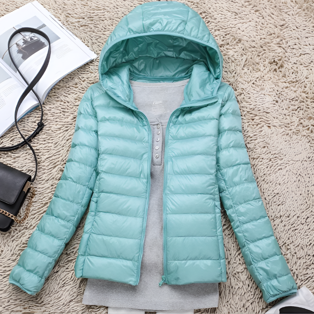 Warm women's packable hooded jacket. Ultra-light, comfortable outdoor wear, ideal for travel & all-season adventures.