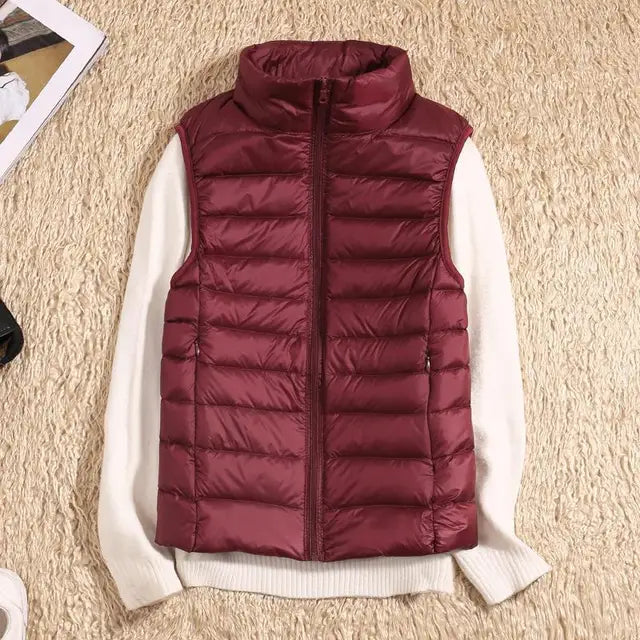 Travel-friendly women's packable puffer vest, offering lightweight warmth for any destination.