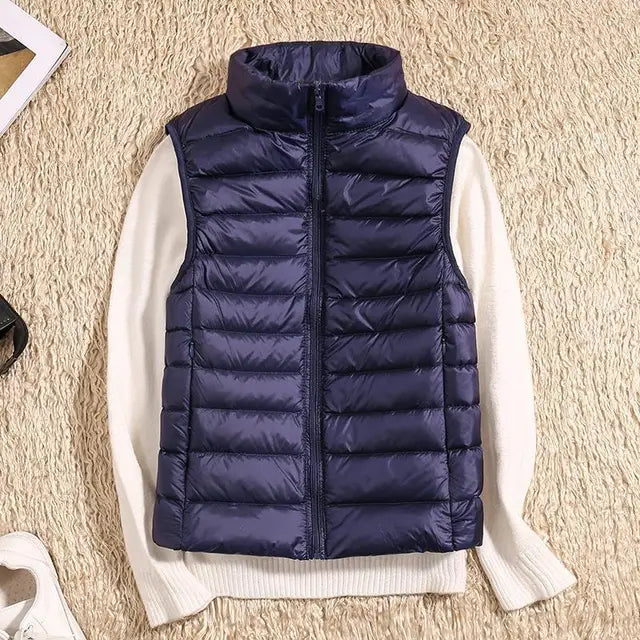 Modern women's puffer vest, ultra-light and warm, a chic layering piece for everyday style.