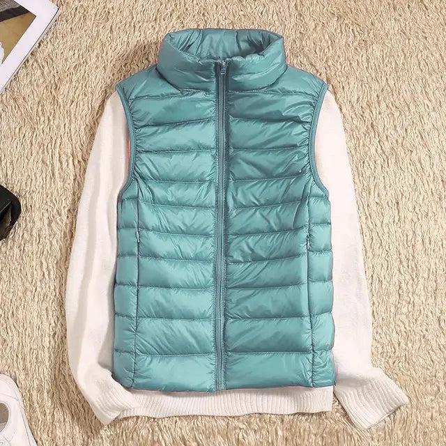 Stylish women's sleeveless puffer vest, perfect for casual wear & outdoor activities.