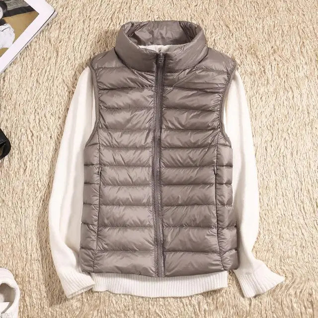 Packable women's puffer vest, an ultra-light & warm travel essential for cold weather.