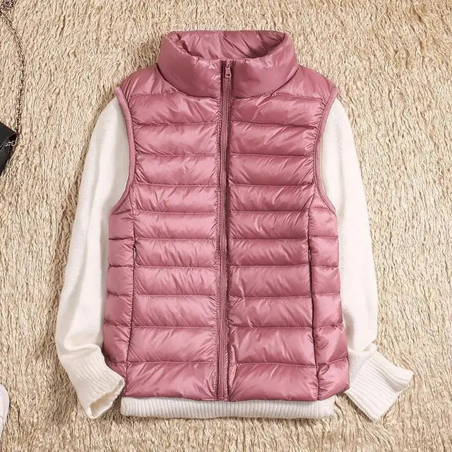 Versatile women's puffer vest, a lightweight layering piece for active and casual wear.