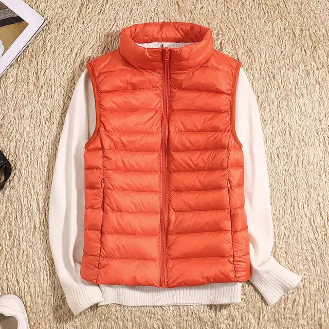 Warm women's puffer vest, a fall fashion staple & winter essential for extra insulation.