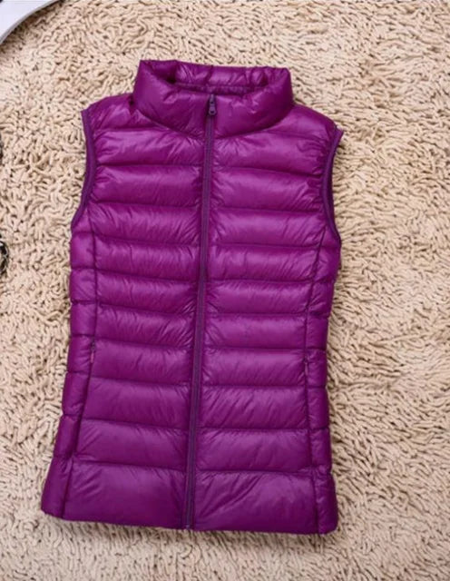 Sleek women's ultra-light puffer vest, designed for comfort and easy packing on the go.