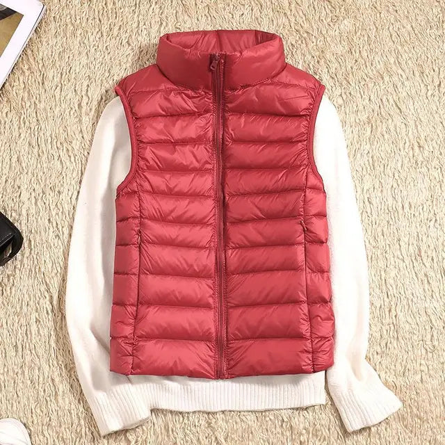 Women's lightweight outdoor puffer vest, providing warmth without bulk for adventures.