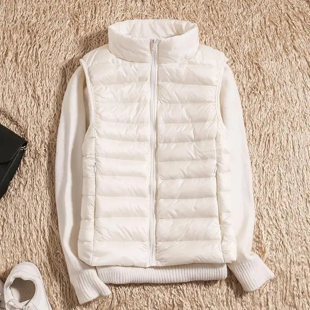 Essential women's puffer vest, an ultra-light layering jacket for year-round warmth & style.