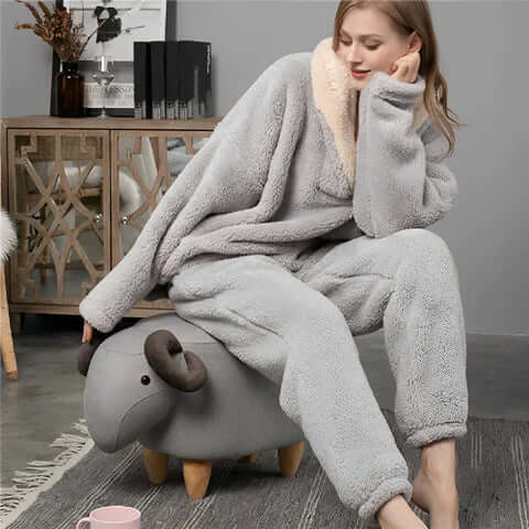 Warm women's fleece pajama set, ultra-soft material provides cozy comfort for sleep or lounging at home.