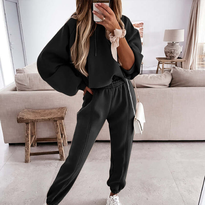 Close-up of the ultra-soft knit fabric of a women's cozy hoodie and joggers loungewear set.