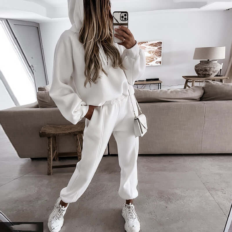 Woman wearing a relaxed fit ultra-soft hoodie and joggers lounge set, showcasing comfortable everyday style.