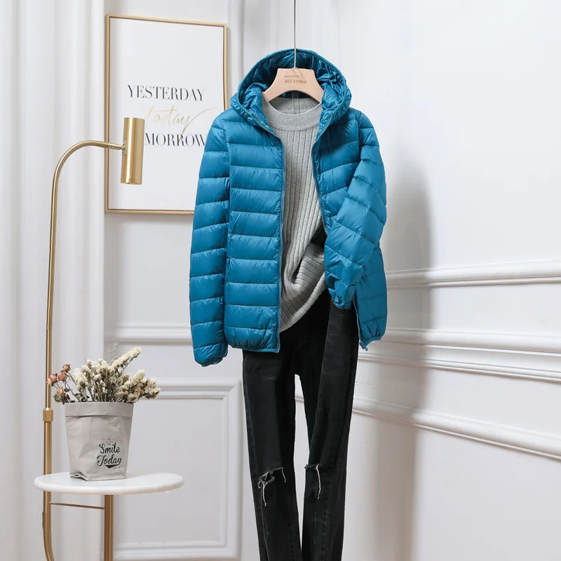 Essential winter outerwear: women's ultralight hooded packable puffer jacket for warmth.