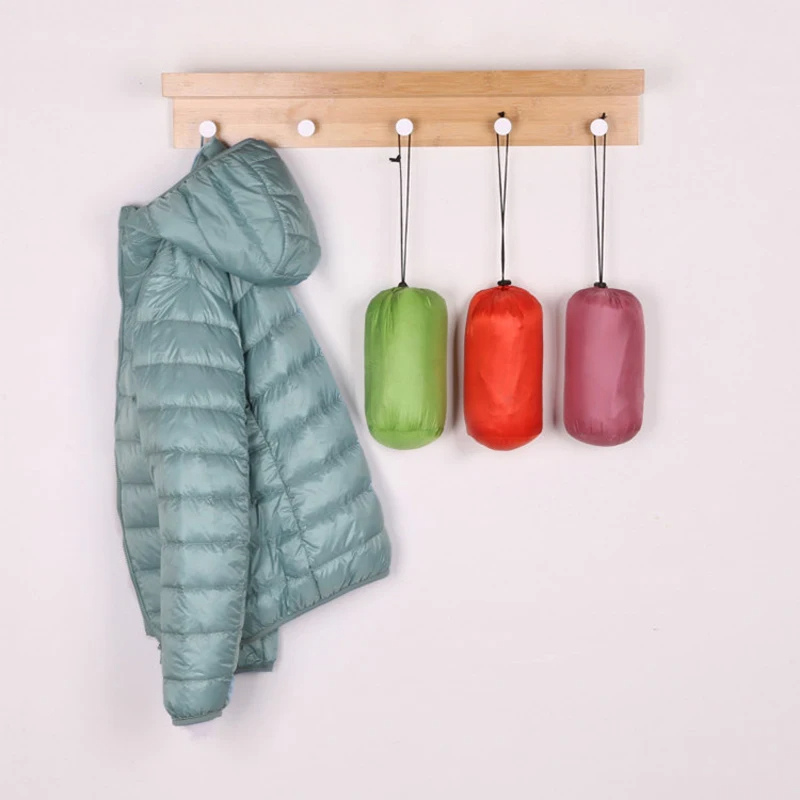 Comfortable ladies ultralight foldable puffer jacket with hood, great for daily casual wear.