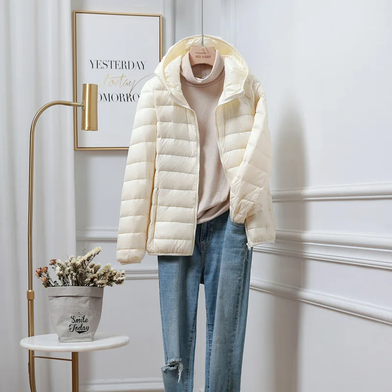 Stylish women's ultralight hooded puffer jacket, a ladies fashion piece for winter outerwear.