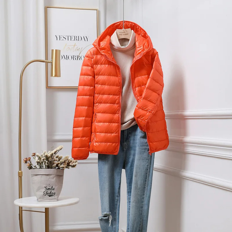 Side view of a women's ultralight foldable puffer jacket, demonstrating a flattering fit.