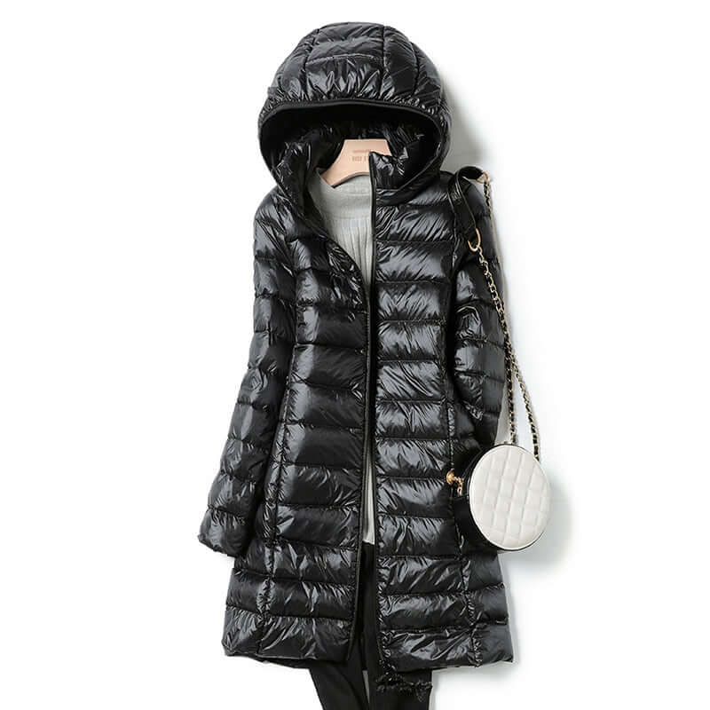 Stylish women's warm ultralight puffer coat. Essential winter jacket for leisure, travel, and casual wear.