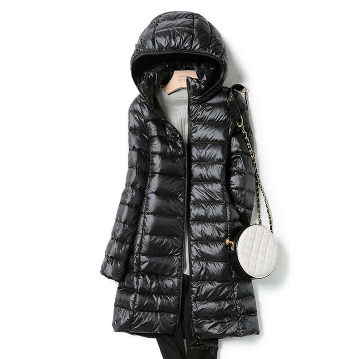 Stylish women's warm ultralight puffer coat. Essential winter jacket for leisure, travel, and casual wear.